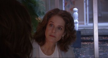 Movie still from “Rachel Getting Married” (2008), directed by Jonathan Demme – A person sitting in front of a window; Close Up shot, Over the shoulder angle