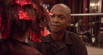 Movie still from “Rachel Getting Married” (2008), directed by Jonathan Demme – A bald man is looking into the mirror; Close Up shot, Over the shoulder angle