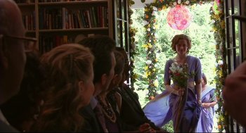 Movie still from “Rachel Getting Married” (2008), directed by Jonathan Demme – A group of people standing in front of a window; Wide shot, Over the shoulder angle