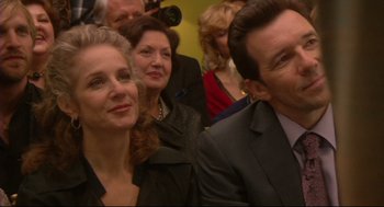 Movie still from “Rachel Getting Married” (2008), directed by Jonathan Demme – A group of people standing next to each other in a room; Close Up shot, Over the shoulder angle