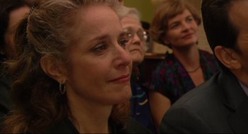 Movie still from “Rachel Getting Married” (2008), directed by Jonathan Demme – A group of people sitting in a room; Close Up shot, Over the shoulder angle