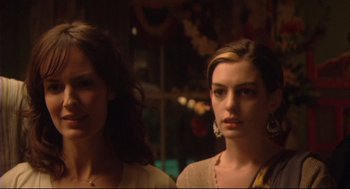 Movie still from “Rachel Getting Married” (2008), directed by Jonathan Demme – Two women standing next to each other in front of a window; Close Up shot, Over the shoulder angle