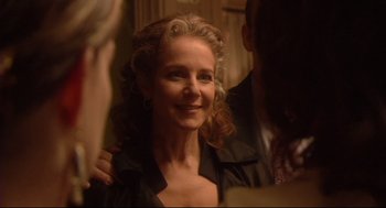 Movie still from “Rachel Getting Married” (2008), directed by Jonathan Demme – A person with curly blonde hair; Close Up shot, Over the shoulder angle