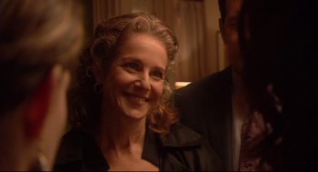 Movie still from “Rachel Getting Married” (2008), directed by Jonathan Demme – A person with a smile on their face; Close Up shot, Over the shoulder angle