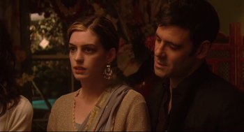 Movie still from “Rachel Getting Married” (2008), directed by Jonathan Demme – A man and a woman standing next to each other; Medium shot, Over the shoulder angle
