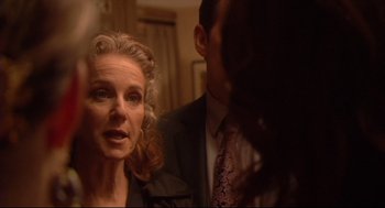 Movie still from “Rachel Getting Married” (2008), directed by Jonathan Demme – An older woman and a younger man in a room; Close Up shot, Over the shoulder angle