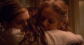 Movie still from “Rachel Getting Married” (2008), directed by Jonathan Demme – Two women hugging each other in a room; Close Up shot, High angle