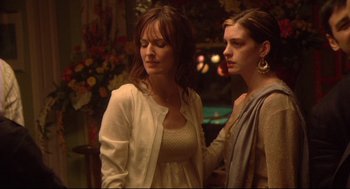 Movie still from “Rachel Getting Married” (2008), directed by Jonathan Demme – Two women standing next to each other near a pool table; Medium shot, Over the shoulder angle