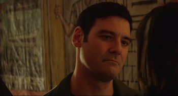 Movie still from “Rachel Getting Married” (2008), directed by Jonathan Demme – A person wearing a black shirt; Close Up shot, Low angle