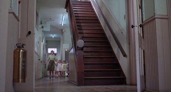 Movie still from “Rachel, Rachel” (1968), directed by Paul Newman – A group of children walking up a set of stairs; Wide shot, Low angle