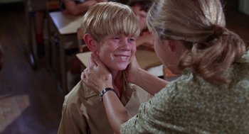 Movie still from “Rachel, Rachel” (1968), directed by Paul Newman – A young boy smiling while being held by a woman; Close Up shot, Over the shoulder angle