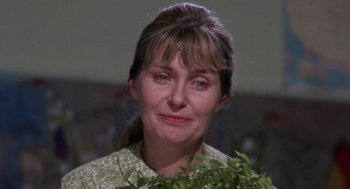 Movie still from “Rachel, Rachel” (1968), directed by Paul Newman – A person holding a plant in her hands; Close Up shot, Over the shoulder angle