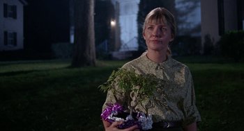 Movie still from “Rachel, Rachel” (1968), directed by Paul Newman – A woman is holding a plant in her hands; Medium shot, Low angle