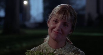 Movie still from “Rachel, Rachel” (1968), directed by Paul Newman – A person smiling at the camera; Close Up shot, Over the shoulder angle