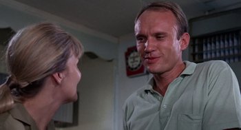 Movie still from “Rachel, Rachel” (1968), directed by Paul Newman – A man and a woman talking in a living room; Close Up shot, Low angle