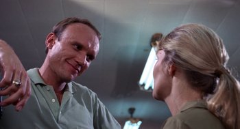 Movie still from “Rachel, Rachel” (1968), directed by Paul Newman – A man and a woman talking to each other; Close Up shot, Low angle