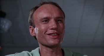 Movie still from “Rachel, Rachel” (1968), directed by Paul Newman – A person smiling for the camera; Close Up shot, Low angle