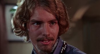 Movie still from “Rachel, Rachel” (1968), directed by Paul Newman – A person with long hair and a beard; Close Up shot, Low angle