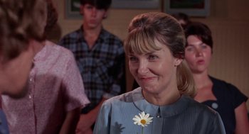 Movie still from “Rachel, Rachel” (1968), directed by Paul Newman – A person with a flower in her hair; Close Up shot, Over the shoulder angle