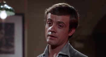 Movie still from “Rachel, Rachel” (1968), directed by Paul Newman – A young man with short brown hair wearing a gray jacket; Close Up shot, Low angle