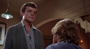 Movie still from “Rachel, Rachel” (1968), directed by Paul Newman – A man standing next to another man in a room; Close Up shot, Over the shoulder angle