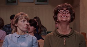 Movie still from “Rachel, Rachel” (1968), directed by Paul Newman – Two women are sitting in a church and one is laughing; Close Up shot, Low angle
