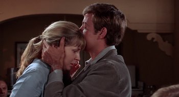 Movie still from “Rachel, Rachel” (1968), directed by Paul Newman – A man and a woman are kissing in a room; Close Up shot, Low angle