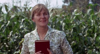 Movie still from “Rachel, Rachel” (1968), directed by Paul Newman – A woman is holding a book in her hands; Medium shot, Low angle