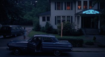 Movie still from “Rachel, Rachel” (1968), directed by Paul Newman – An old car parked on the side of the street; Extreme Wide shot, High angle