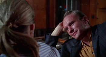 Movie still from “Rachel, Rachel” (1968), directed by Paul Newman – A man and a woman sitting in front of each other; Close Up shot, Over the shoulder angle