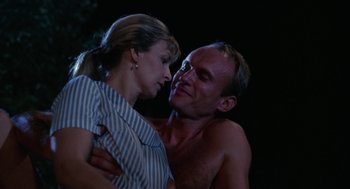 Movie still from “Rachel, Rachel” (1968), directed by Paul Newman – A man and a woman embracing each other in the dark; Close Up shot, Low angle