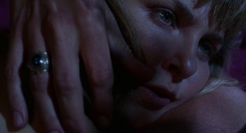 Movie still from “Rachel, Rachel” (1968), directed by Paul Newman – A woman's face with her hands touching her face; Extreme Close Up shot, Overhead angle