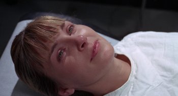 Movie still from “Rachel, Rachel” (1968), directed by Paul Newman – A person's face with eyes closed; Close Up shot, Overhead angle