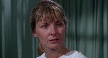 Movie still from “Rachel, Rachel” (1968), directed by Paul Newman – A person wearing a white shirt; Close Up shot, Over the shoulder angle