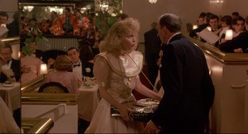 Movie still from “Radio Days” (1987), directed by Woody Allen – A man and a woman in formal wear at a party; Medium shot, Over the shoulder angle