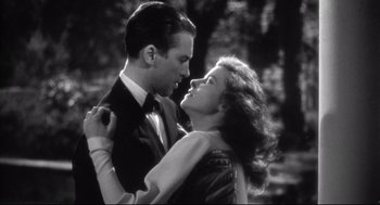 Movie still from “Radio Days” (1987), directed by Woody Allen – A man and a woman are dancing in a forest; Medium shot, Low angle