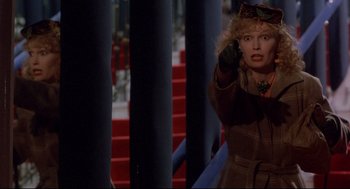 Movie still from “Radio Days” (1987), directed by Woody Allen – A woman in a brown coat and a cat on her head; Medium shot, Over the shoulder angle