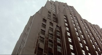 Movie still from “Radio Days” (1987), directed by Woody Allen – A very tall building that is very tall and very tall; Extreme Wide shot, Low angle