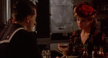Movie still from “Radio Days” (1987), directed by Woody Allen – A man and a woman sitting at a table in a restaurant; Close Up shot, Over the shoulder angle