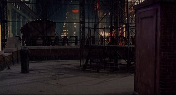 Movie still from “Radio Days” (1987), directed by Woody Allen – A view of a city at night from the ground; Extreme Wide shot, High angle