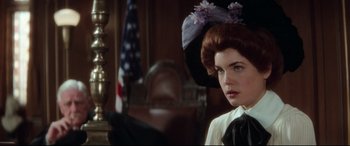 Movie still from “Ragtime” (1981), directed by Milos Forman – A person wearing a hat; Close Up shot, Over the shoulder angle