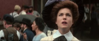 Movie still from “Ragtime” (1981), directed by Milos Forman – A person wearing a hat; Close Up shot, Over the shoulder angle