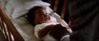 Movie still from “Ragtime” (1981), directed by Milos Forman – A child laying in a bed; Close Up shot, High angle