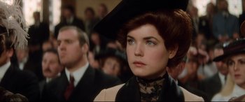 Movie still from “Ragtime” (1981), directed by Milos Forman – A person wearing a hat; Close Up shot, Over the shoulder angle