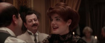 Movie still from “Ragtime” (1981), directed by Milos Forman – A man and a woman smiling for the camera; Close Up shot, Over the shoulder angle