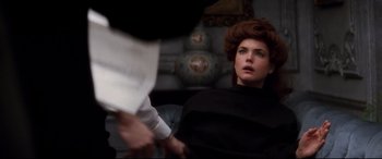 Movie still from “Ragtime” (1981), directed by Milos Forman – A woman sitting in front of a man holding her hand; Close Up shot, Over the shoulder angle