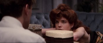 Movie still from “Ragtime” (1981), directed by Milos Forman – A woman with a hat sitting in front of a mirror; Close Up shot, Over the shoulder angle