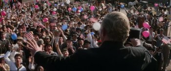 Movie still from “Ragtime” (1981), directed by Milos Forman – A large crowd of people are gathered together; Medium shot, High angle