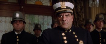 Movie still from “Ragtime” (1981), directed by Milos Forman – A person wearing a uniform; Close Up shot, Low angle