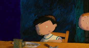 Movie still from “Raining Cats and Frogs” (2003), directed by Jacques-Rémy Girerd – A boy sitting at a table with a plate in front of him; Close Up shot, High angle